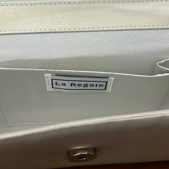 Silver clutch purse with bow detail on front - Picture 5 of 6